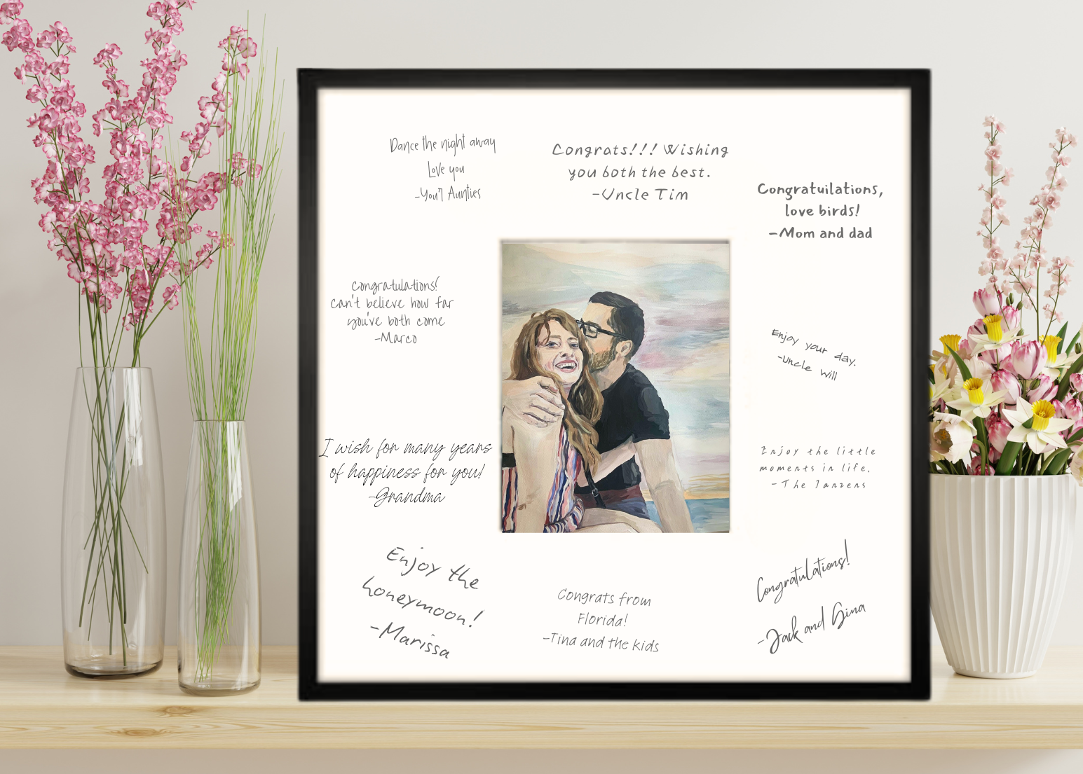 in this watercolor painting, a man and woman are kissing on the beach. notes of congratulations are written around it