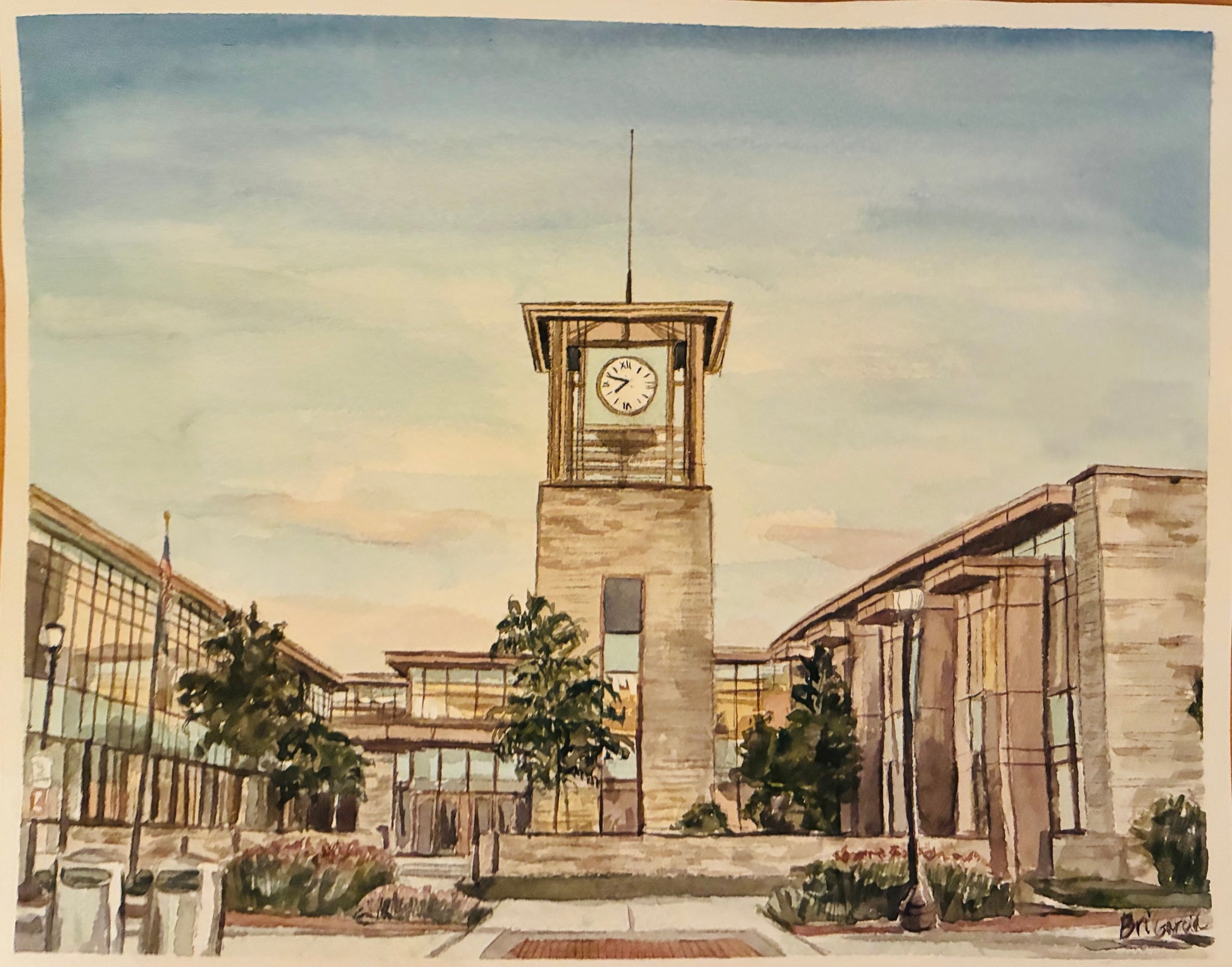 This is a watercolor painting of a city building at sunset