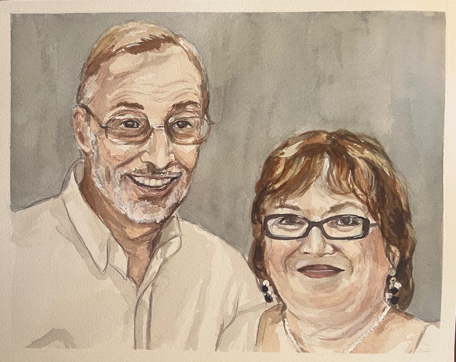 watercolor painting with a man and a woman smiling at the camera. They are in white clothes with a solid background