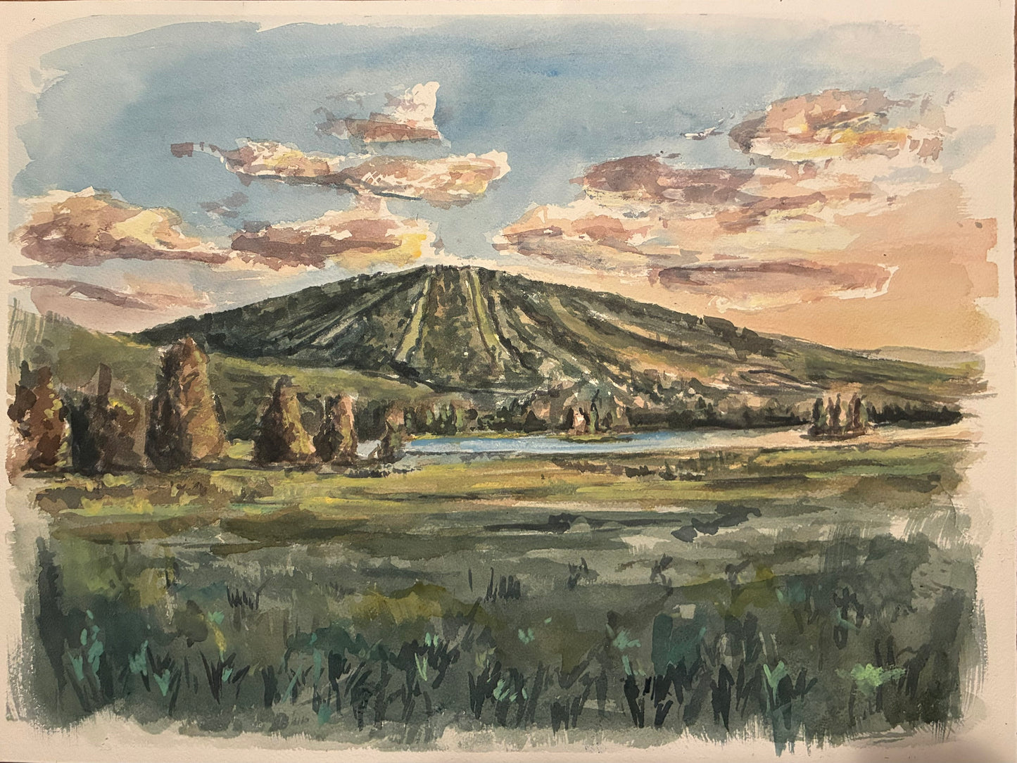 this watercolor painting is a mountain and sunset 